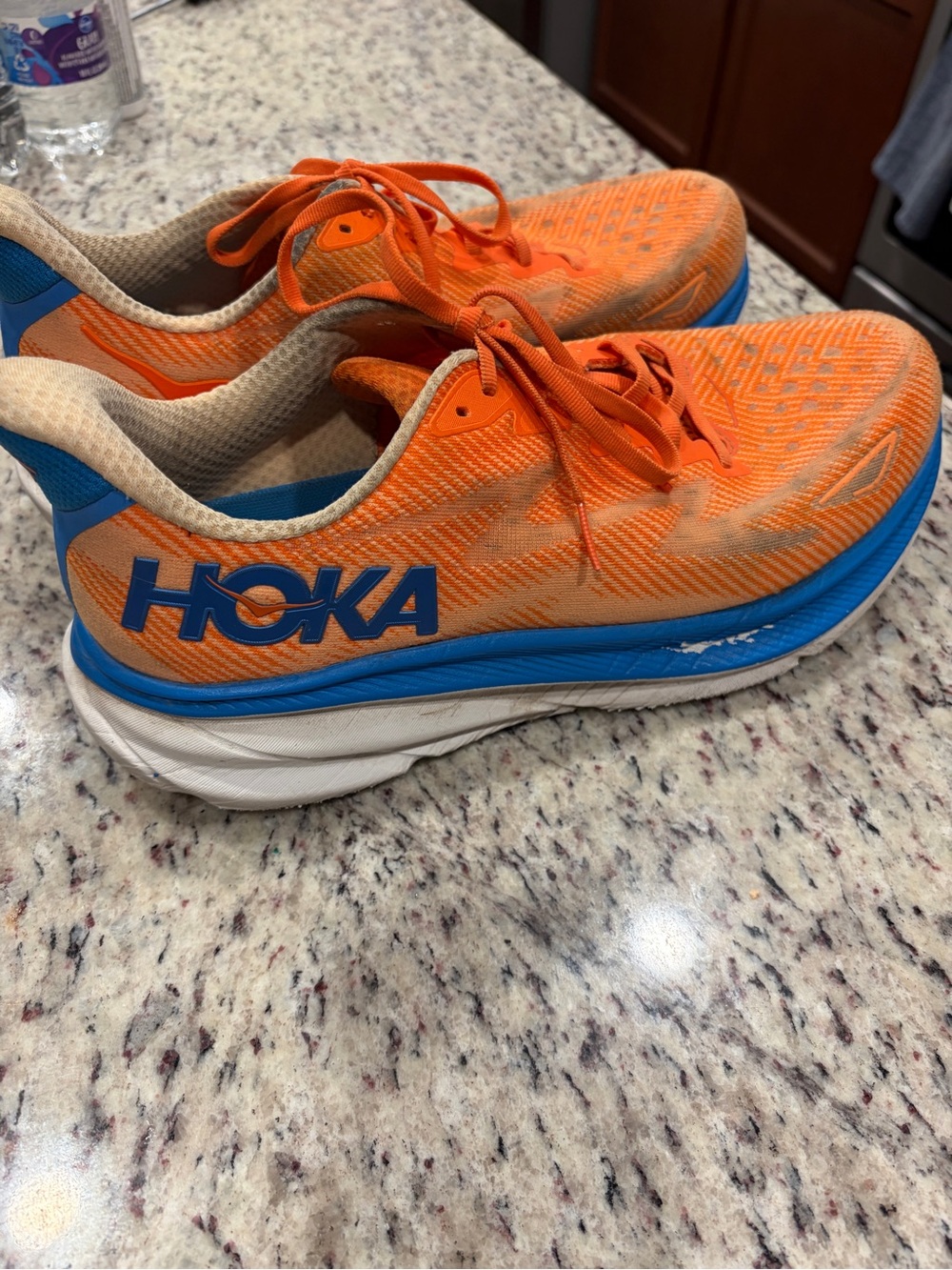 Hoka Men's Bright Orange Running Shoes with Blue Accents